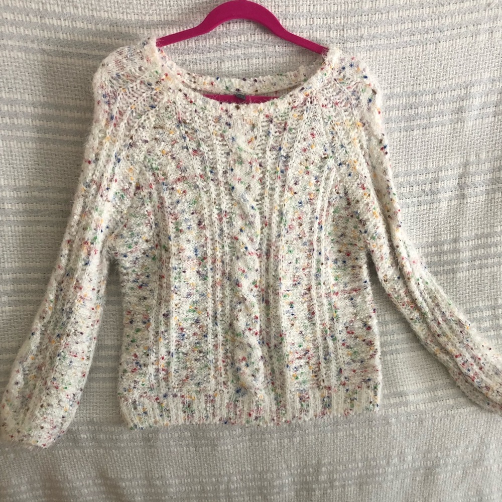 Soft white sweater with confetti like accents!